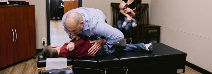 Chiropractor Harrison AR Paul Williams Adjusting Boy